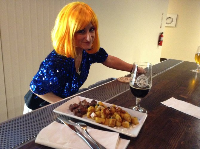 Dana, dressed as Lady Gaga for Halloween, brings my gnocchi