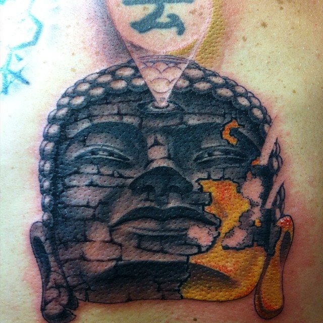 My Buddha is insightful and will bring me enlightenment and good fortune forever. I got this tattoo because I have become more successful in my life only because I had to become enlightened about myself and learn to strive to always be better. I am 29 and a full time student at SDSU, currently live in La Mesa but got this tattoo from Bill "Peacemaker" over at Chronic Tattoo in Pacific Beach. They have the best artists around.
