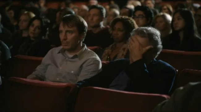 Robert DeNiro (Robert DeNiro) and another actor (not Robert DeNiro) attend a Robert DeNiro movie marathon in this commercial for Santander Bank starring Robert DeNiro.