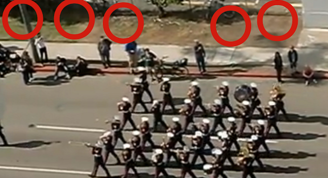 USMC Band parades down Pacific Highway; red circles indicate former campsites of homeless vets.