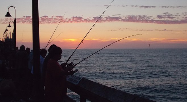 I.B.’s pier is all about fishing, especially at sunset.
