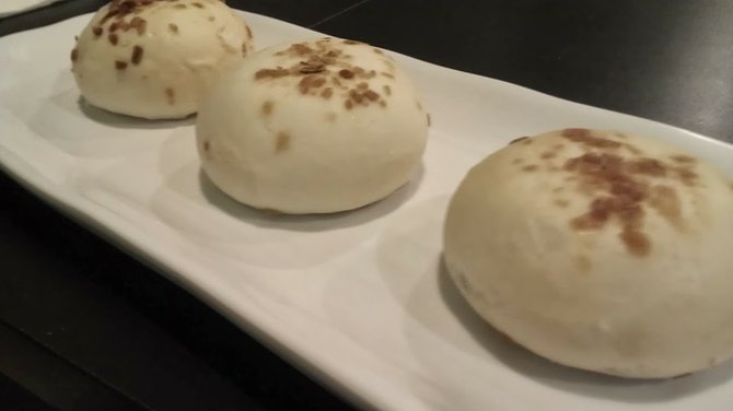 Steamed buns stuffed with Philly cheese steak.  