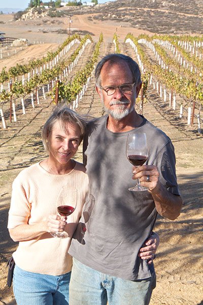 “We don’t want to grow if that means pricing out vinophiles,” say Andy Harris (with wife Carolyn) of Chuparosa.