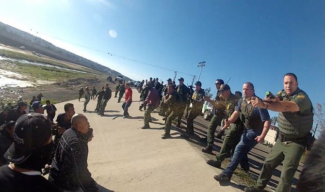 Border Patrol facing the crowd