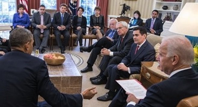 Solana Beach Presbyterian pastor Mike McClenahan (seated third from left, far side of room) at an immigration-reform meeting with the president and vice president.