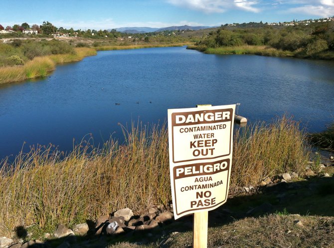 Signs warn of contamination at Lake Calavera