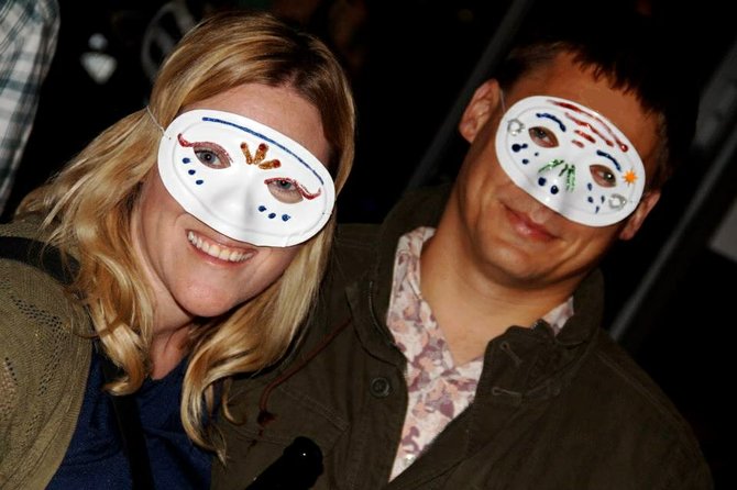 Siobhan and Aaron Braun wearing tragic DIY masks.