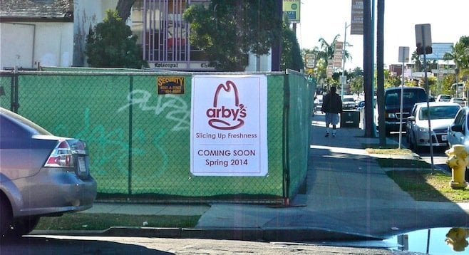Construction fencing with Arby's sign (since removed)