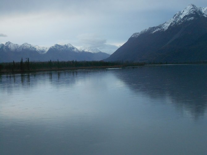 Alaskan rivers surrounded by snow-tipped mountain tops near Seward.