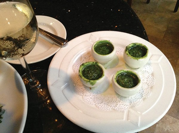 The snails, hiding in little white individual pots with a green parsley-ish garlic-and-herb sauce.