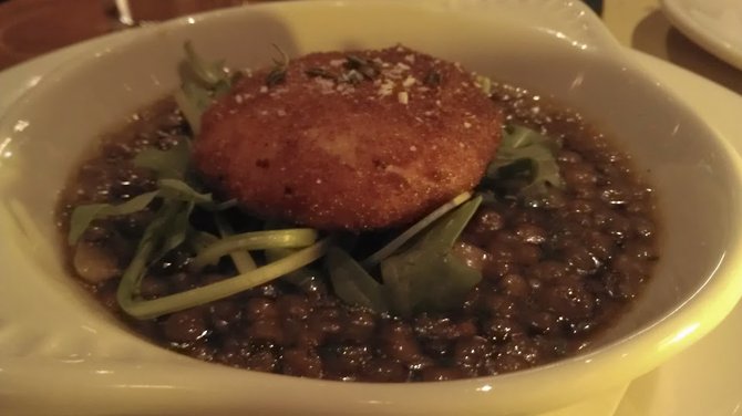 Fried goat cheese atop a bed of lentils.