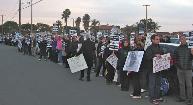 Teachers and supporters gathered outside the December 9 meeting