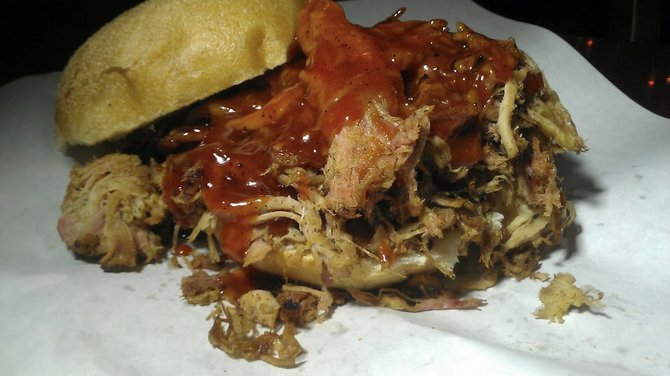 Pulled pork sandwich, loaded with cole slaw and not enough sauce.  