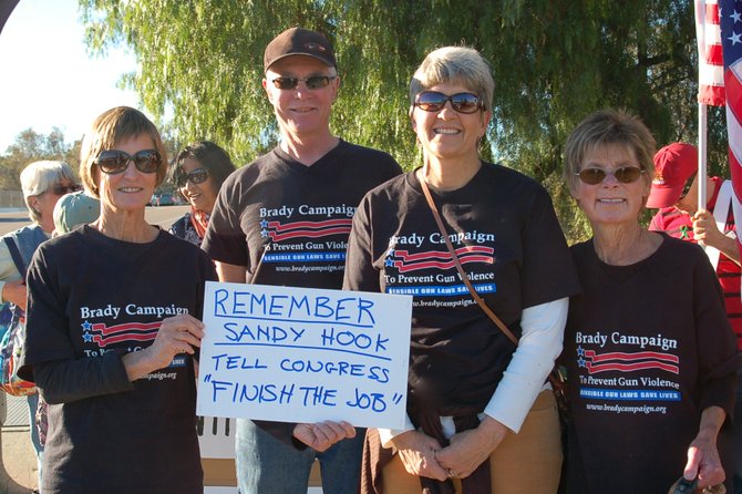 Four of the anti-gun-violence demonstrators rallying at Westfield North County in Escondido on Saturday
