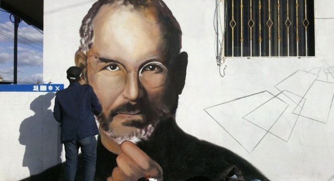 Buho works on recreating the Jobs portrait in mural form