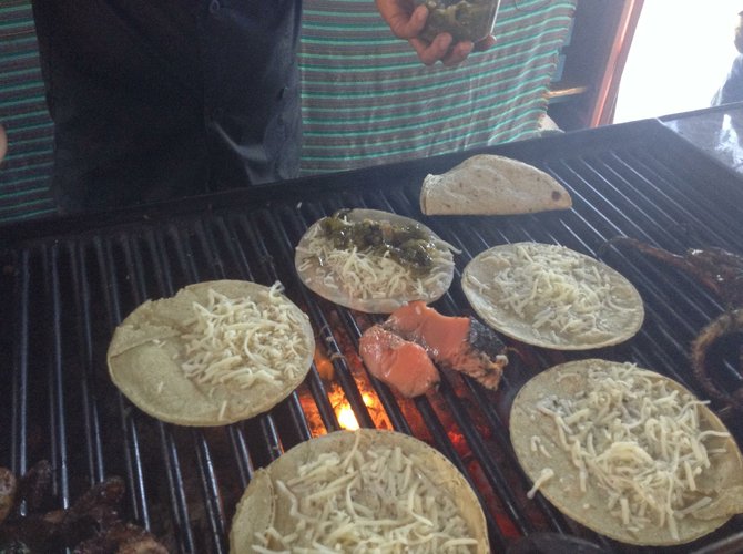 Tacos and salmon on mesquite grill