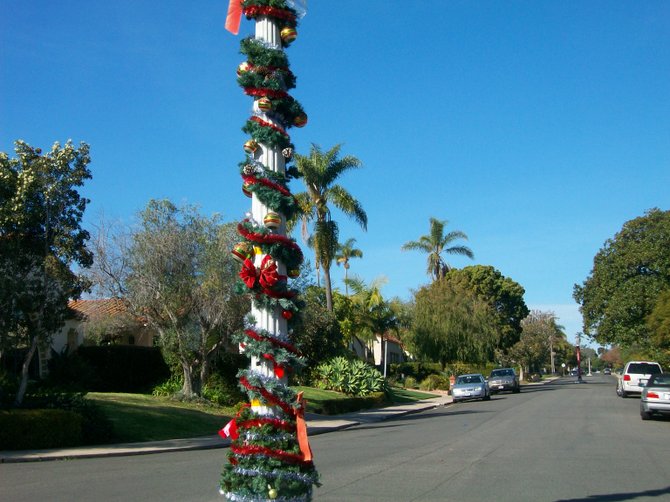 Point Lomans decorate their street light posts for the yuletide.