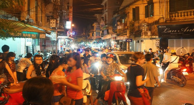A sampling of Vietnamese traffic near a night market in Hanoi's Old Quarter. 
