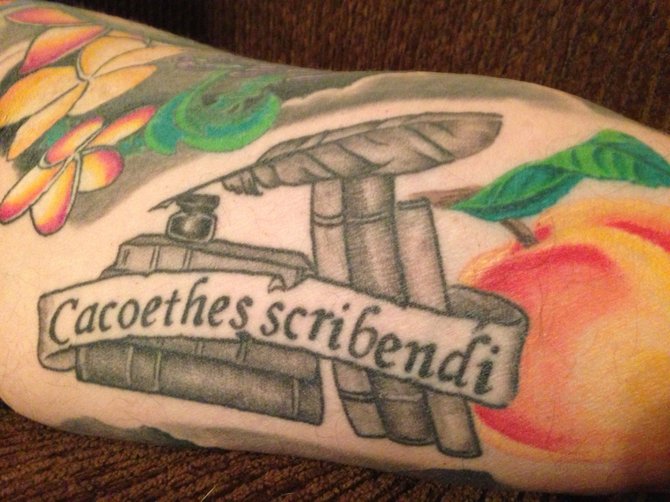 I write every day, either an article, a column, a blog, or a part of a book I'm finishing. My tattoo is "Cacoethes Scribendi."  This is Latin for "the burning, maniacal, feverish desire to write."  It is the title of a poem by Oliver Wendell Holmes Jr.  I got it from Steve Mast from Avalon Tattoo in PB. I'm a 51 year-old author living in Alpine. Thanks!