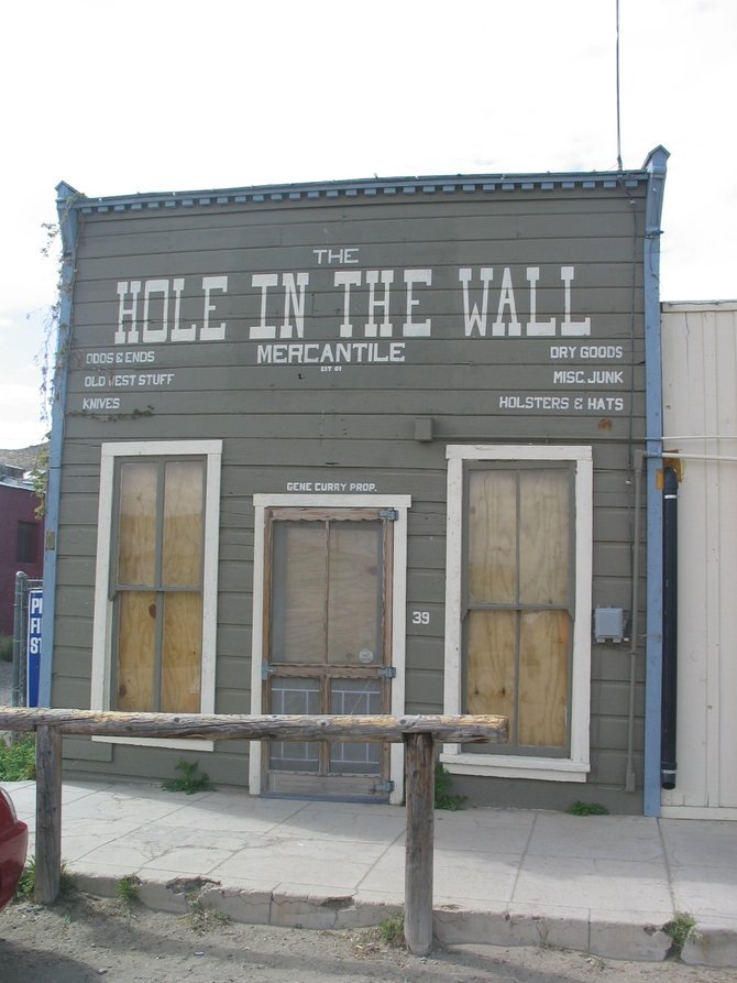Hole in the Wall general store, with hitching post. 