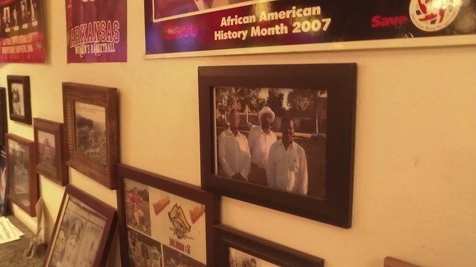 Notable black figures on the wall at Barnes BBQ