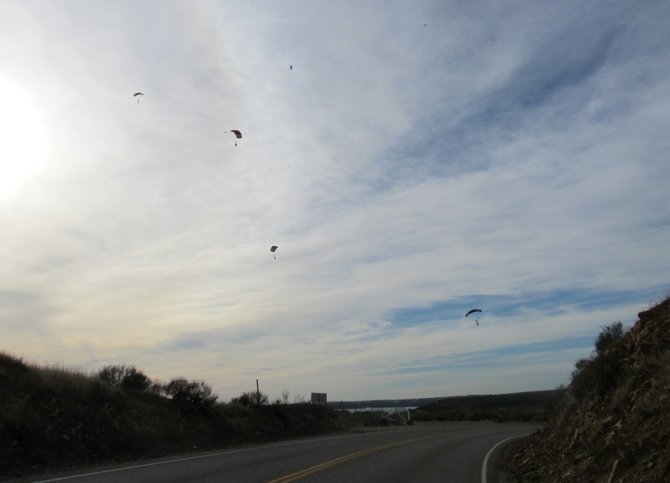 Skydivers descending down on Otay Lakes Road.