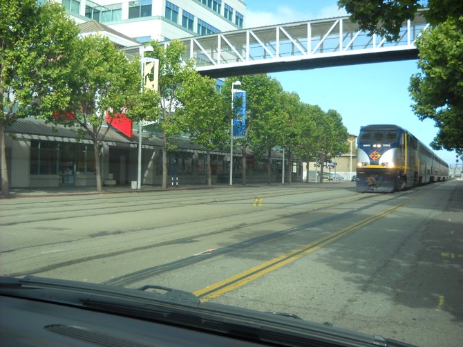 Amtrak train coming through downtown Oakland, CA.