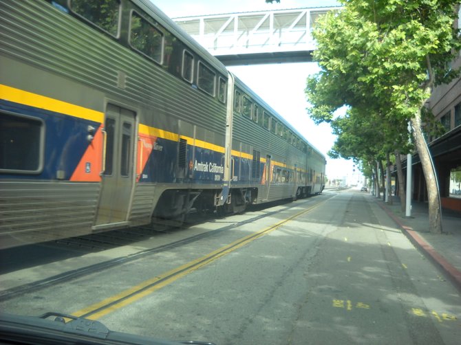 Amtrak train rolls through central Oakland, Ca.
