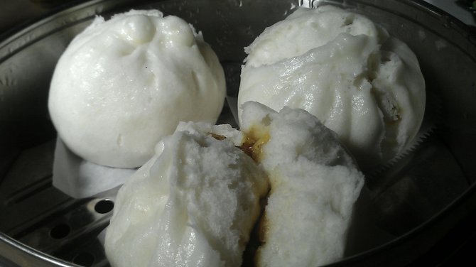 Steamed buns, in this case filled with char siu pork.
