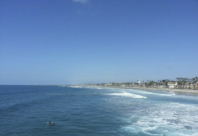 Looking at the surfers from the Oceanside pier.