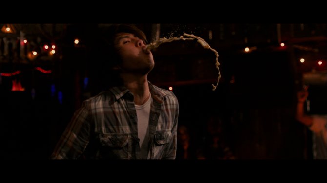 Justin Chon, puking his guts up to wring a laugh or two in 21 & Over.