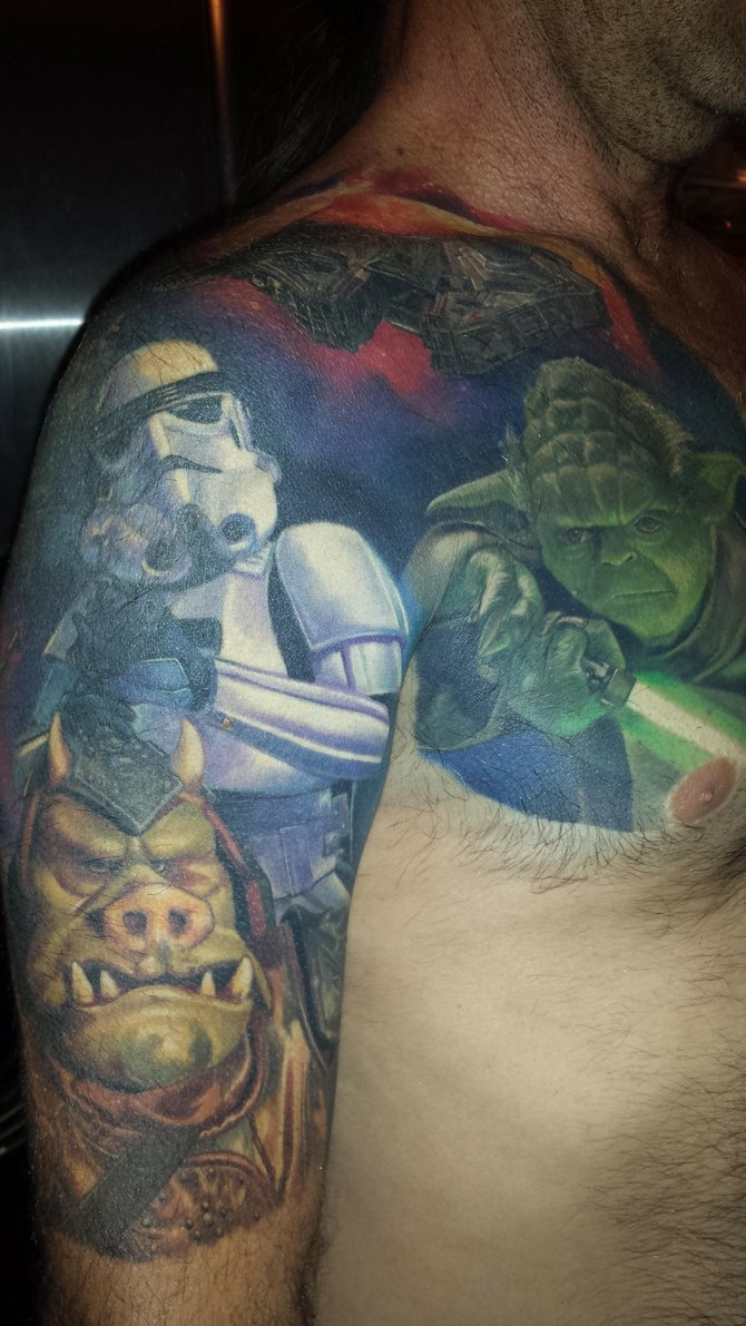 I'm Charger Steve and as a kid couldn't wait for the next Star Wars movie to premier. So, like many other 45 year olds anything Star Wars brings back fond memories! So... Didn't take much for Carlos Rojas to convince me to get some SW Ink! His work is great! He works out of Black Anchor in Hisperia and while it's a drive for me living in Ramona.... It's worth it! May The Force Be With You!