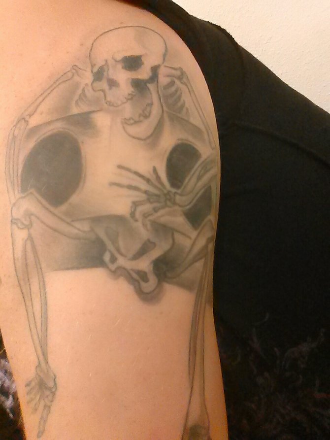 I got this tattoo because it represents my passion for automotive audio. It is a skeleton hold a subwoofer box. It meams bass till i die. I got it done by Casey over anf tokyo blaq in poway. 