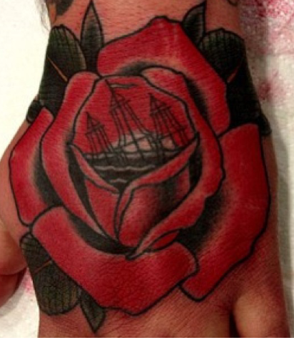 Sinking ship in a rose on my hand. Tradional tattoos rule. Done by my friend Ben Grillo at Power Tattoo in Vista. 