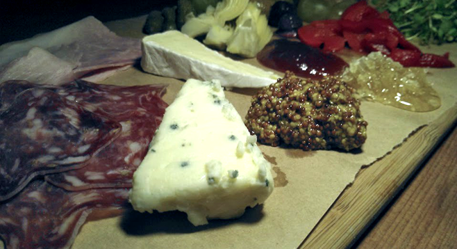 Sycamore Den's meat and cheese board.  The olives can stay, but everything else doesn't gel with the bar's cocktails.