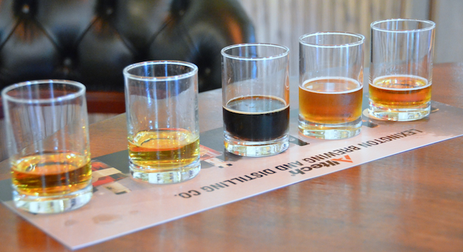 Bourbon, malt whiskey and beers ready for tasting at Lexington's Town Branch Distillery. 