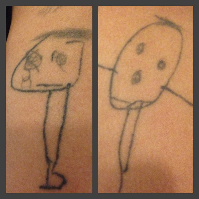 i wanted something that came straight from my daughters hands. this was drawn by her at age 3 and now she is 10. funny thing is that  these drawings were compared to some that i drew at here age and they look exactly the same. these tattoos on my shoulder will be with me until i'm 6 feet under