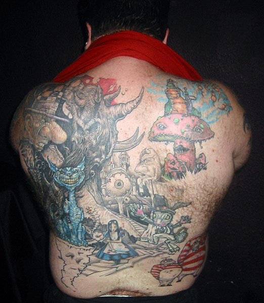 Tattoo You: I love to game and I love Alice in Wonderland. This back piece is my love for the two combined. 