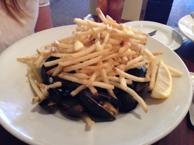 Mussels, hiding beneath fries