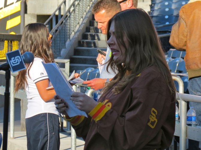 Candidate Samantha Wynn Greenstone reading a script for a chance to become the new P.A. announcer for the San Diego Padres.