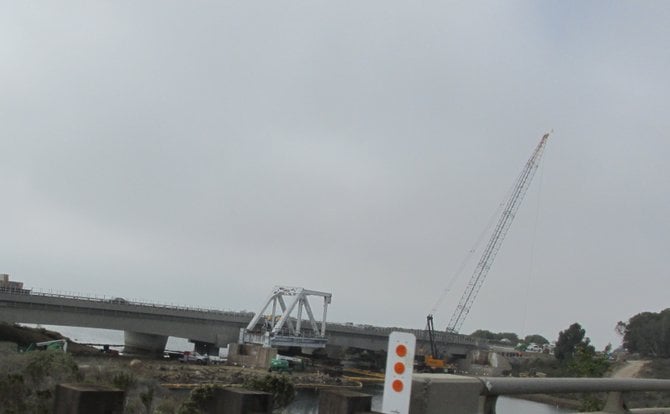 The final section of the 1927 Santa Margarita River bridge being dismantled