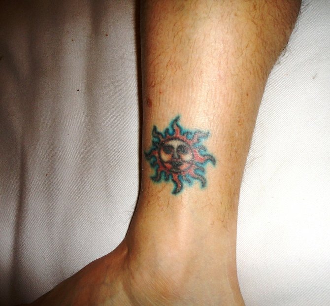 I got this tattoo of a flaming sun on my ankle 20 yrs ago at CrossRoads Tattoo while attending college in Iowa City, IA. It was the height of grunge music and a friend had told me this was Eddie Vedder only ankle tattoo. I later learned he doesnt have a sun, he has a tomahawk. Oh well. I'm 39, live in Coronado and work at vigiluccis restaurant.  