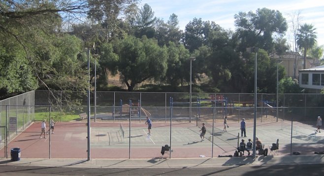 Pickleball players on temporarily converted tennis court