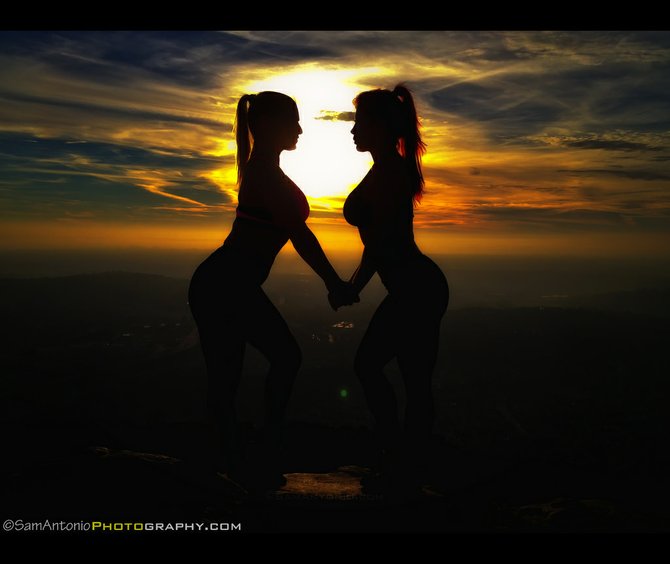 Sunset silhouette of two fit hikers at the summit of Cowles Mountain. Copyright Sam Antonio Photography. www.samantonio.com