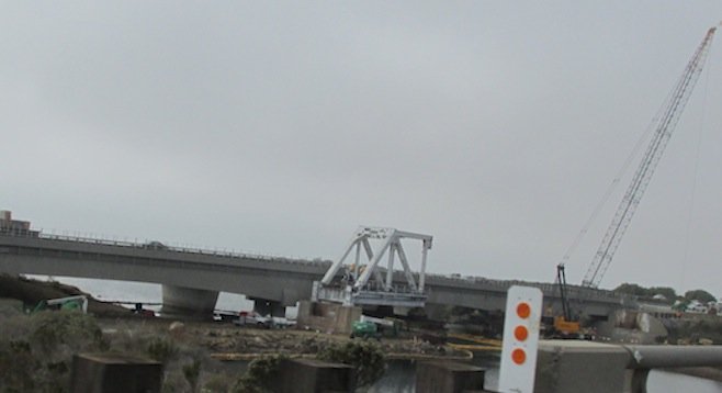 Old truss bridge segment in foreground