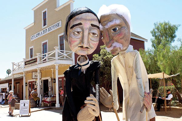 Write Out Loud’s 14-foot-puppets, Edgar and Sam