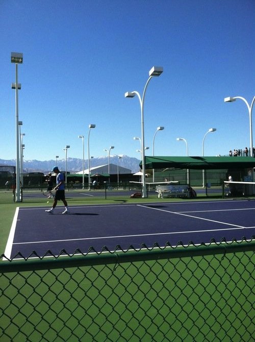 Indian Wells practice courts, snowcapped San Jacinto Mountains in the background.

