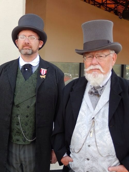 Mr. James Keeline and Mr. George Lusk, pictured standing outside the Westfield mall in Carlsbad on Sunday 2/9/2014 about 1:15, just after they (and approx. 15 other "steampunk" hobbyists) were told they had to leave because of the way they were dressed, which as you can see, is exquisite! Photo taken by Mrs. Laura Lusk.