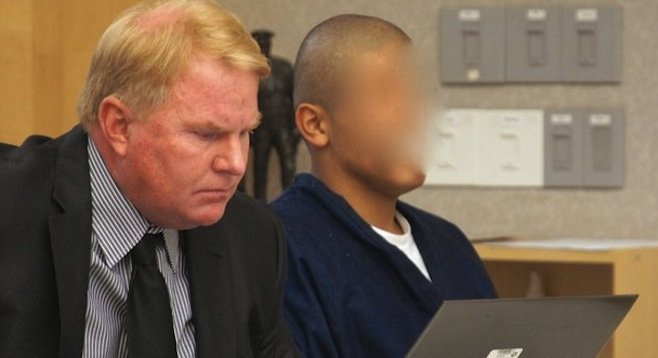 Defense attorney Jeff Reichert and Ruben Cardenas (obscured face ordered by judge)
