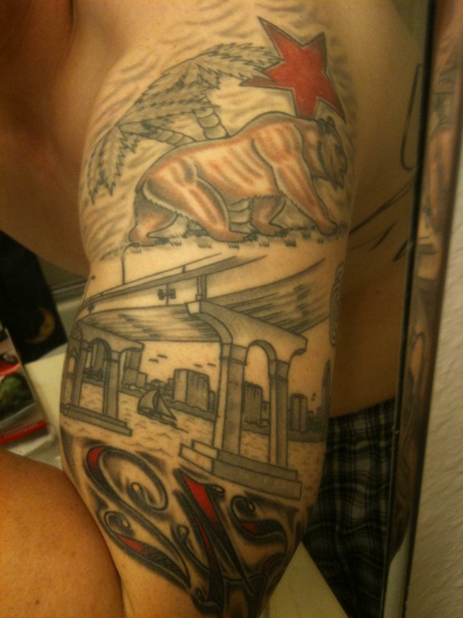 This is a tattoo of the san diego bay along with the the califonia bear it represents my home town and where i am from and still living! The 1542 is the year the bay was founded which is also at the cabrillo national monument! I think this would be a great cover photo to represent sd and the reader magazine being from sd!! I am also sending other pics of this tattoo at another angle along with a pic of myself. My email is Wrcklsmestiso619@yahoo.com
